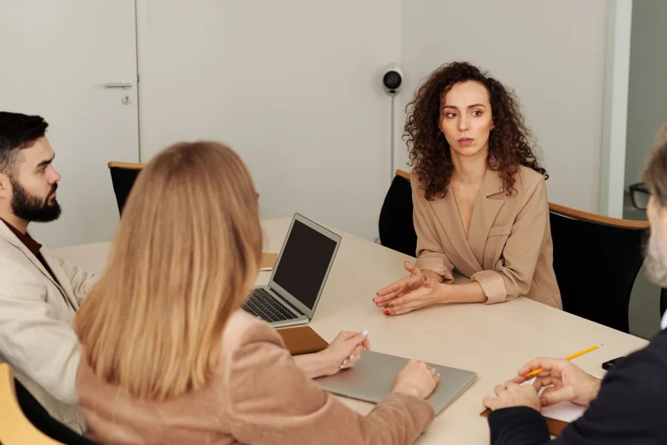 Professionals collaborating around an office table
