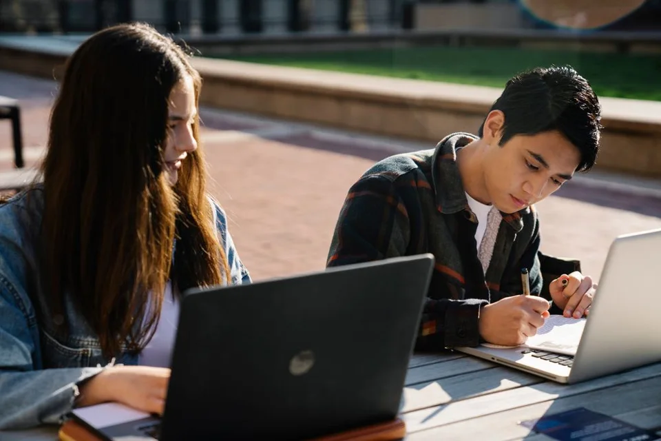 University students studying together outdoors