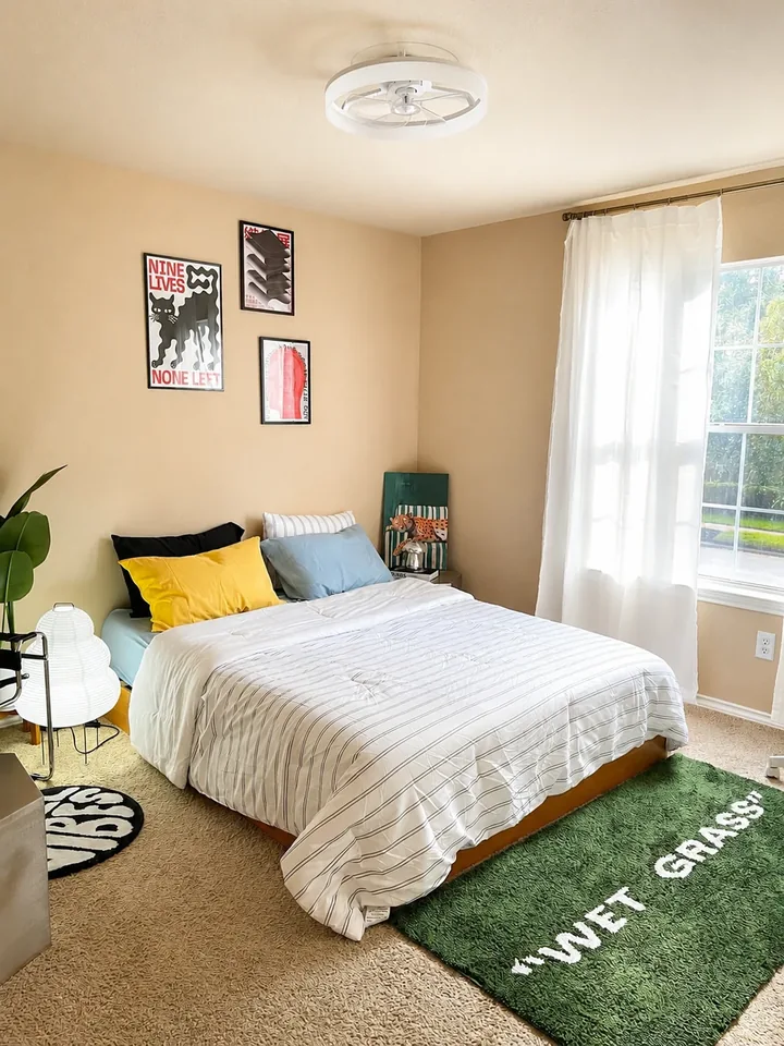 Graphic artwork and a colorful queen bed in Designer Loft