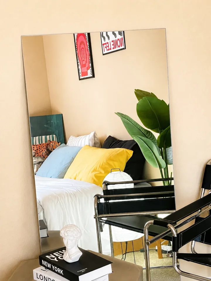 Art, greenery and a mirror reflecting the colorful Designer Loft