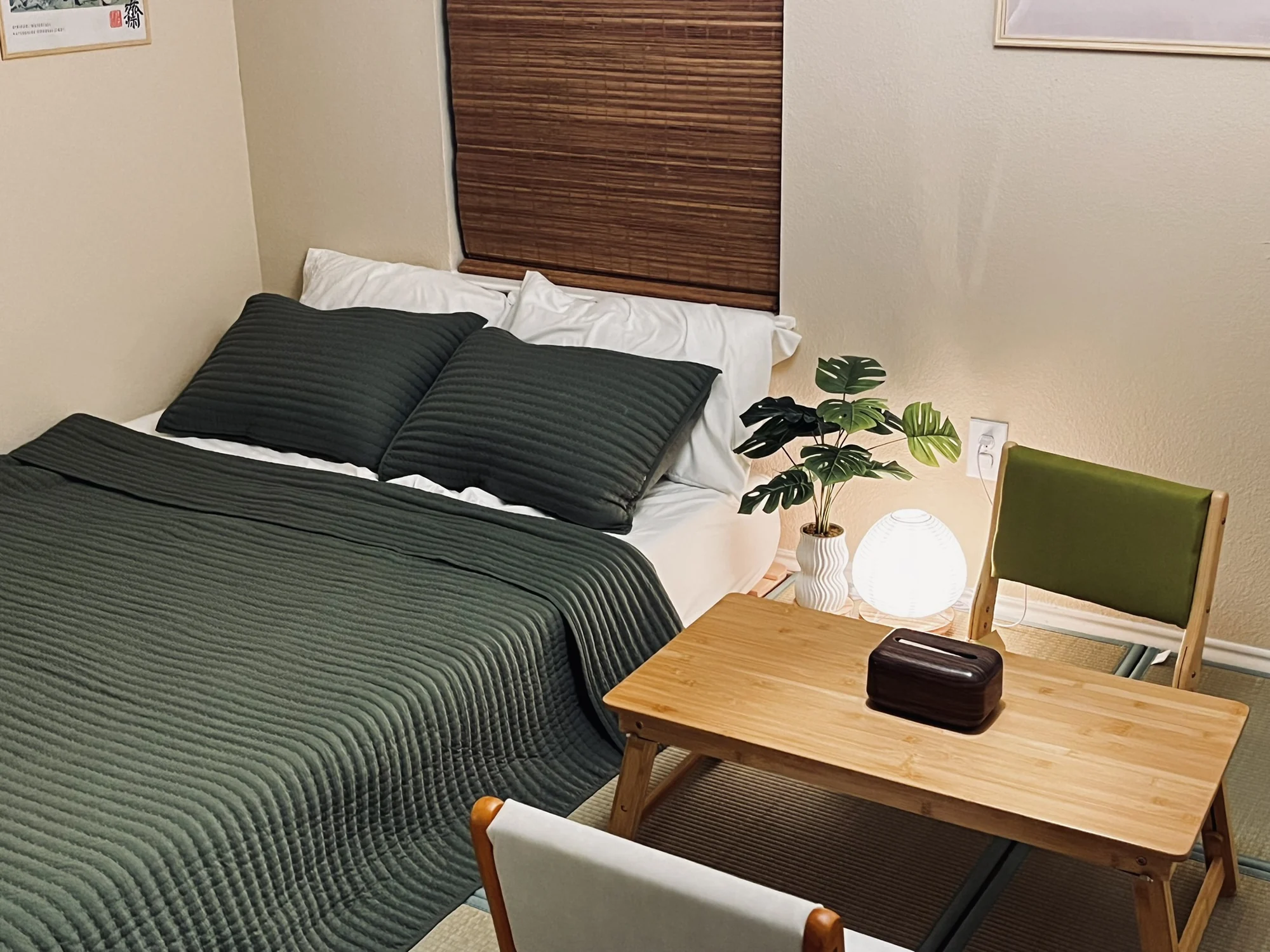 Green bedding and a low wooden table in The Pause